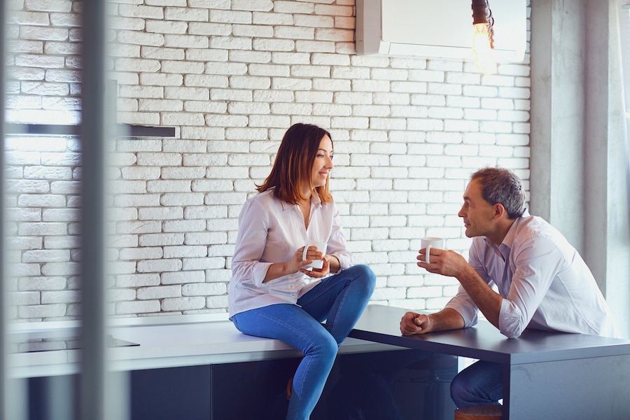 Mature couple talking indoors.