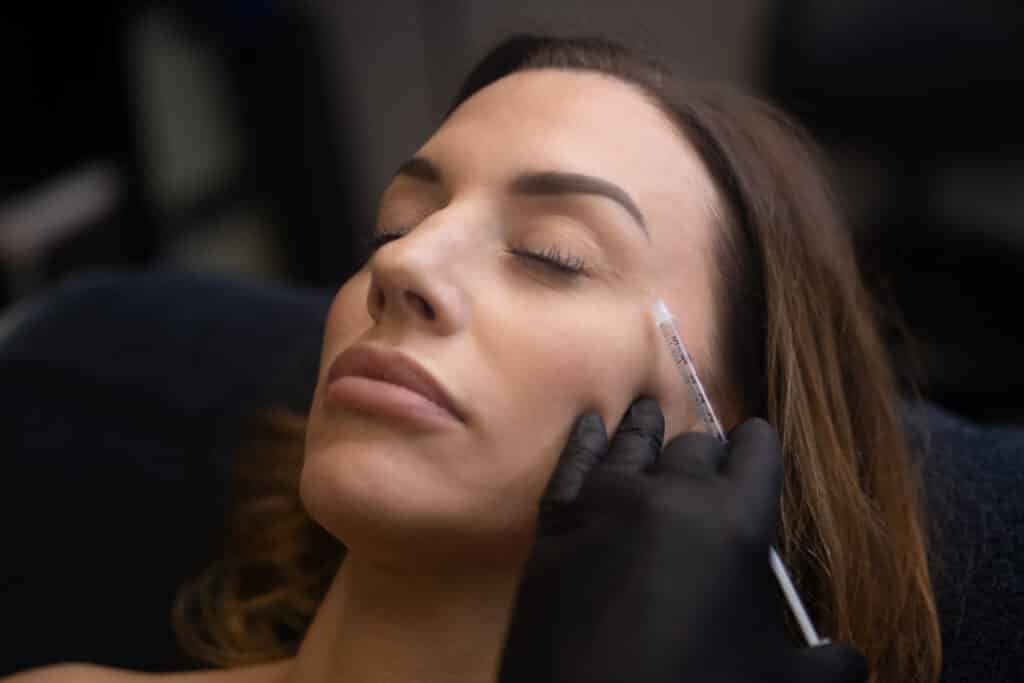 Botox being injected near a woman's eyelid at Facetté Medical Spa in Fort Collins, Colorado