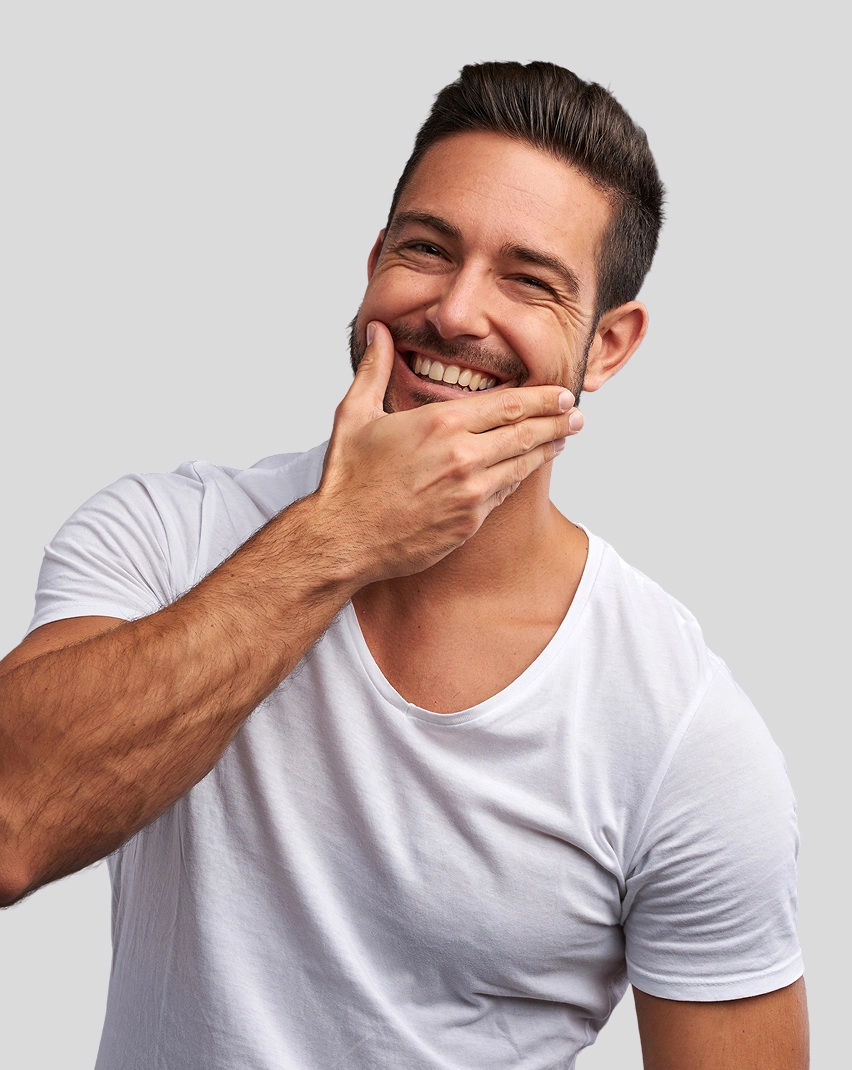caucasian man with right hand over chin smiling